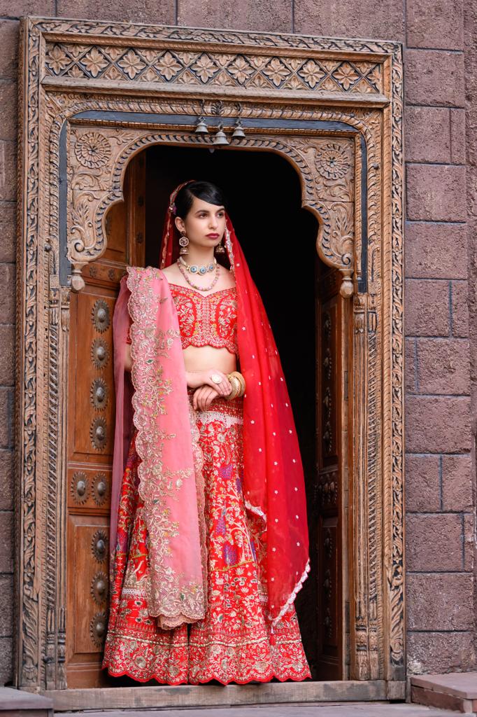 Red bridal boat embroidered lehenga set